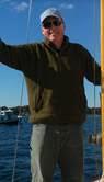 image of Captain Jack on boat with water behind him