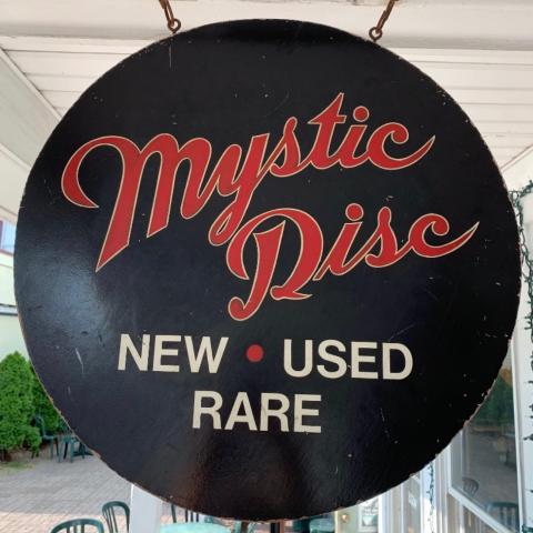 the shop sign for Mystic Disc