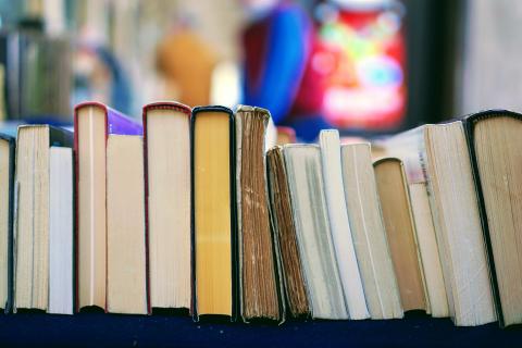 A photo of books on a book truck