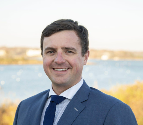 Portrait of Neil Anthes in front of an oceanview