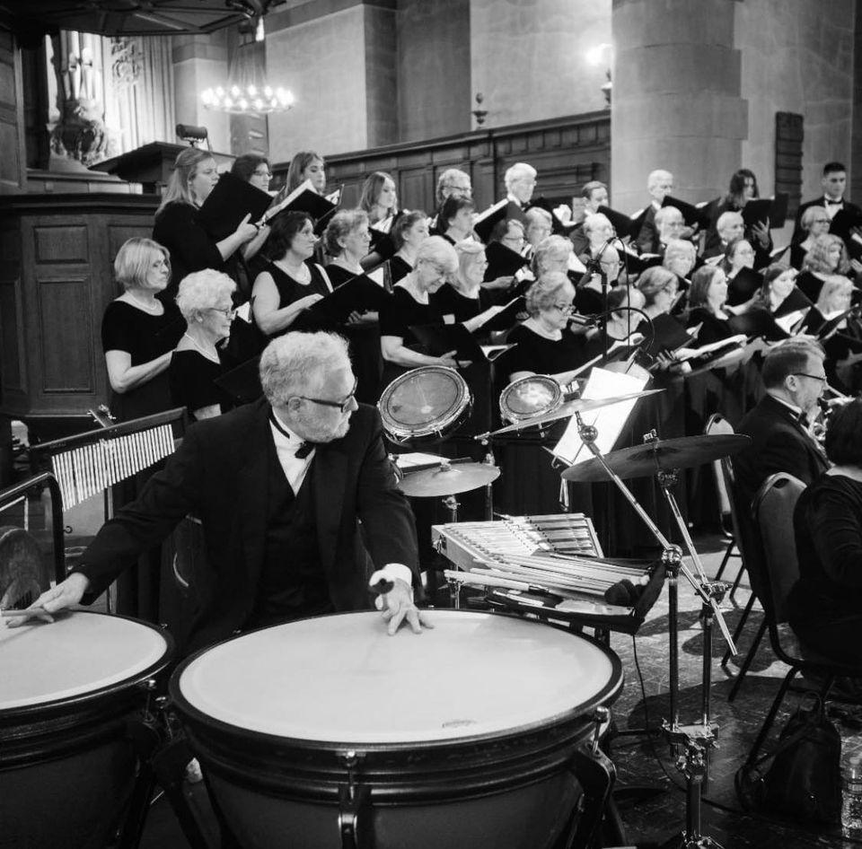 black & white photo of mystic river chorale with instrumental accompaniment 